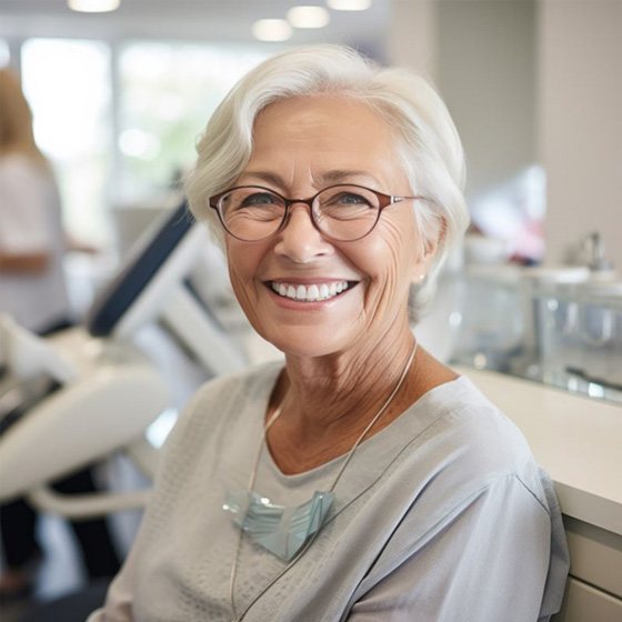 Smiling older woman in dental clinic