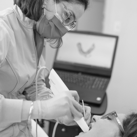 Dentist capturing digital dental impressions of a patient