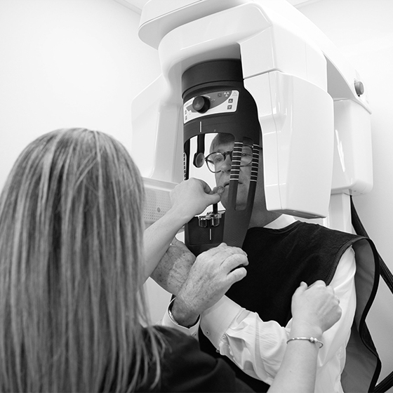 Dental patient receiving cone beam scan of his mouth