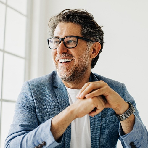 Businessman smiling at meeting 