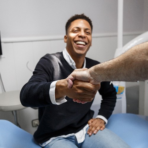 Patient in Boston smiling with their dental implants