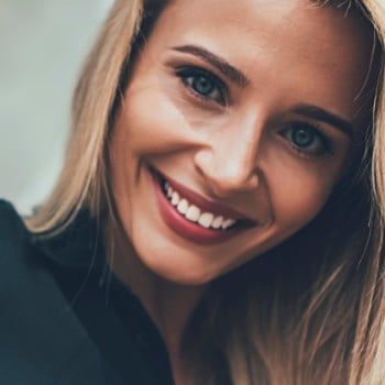 Blonde woman grinning