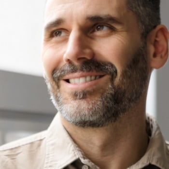 Smiling man in collared shirt