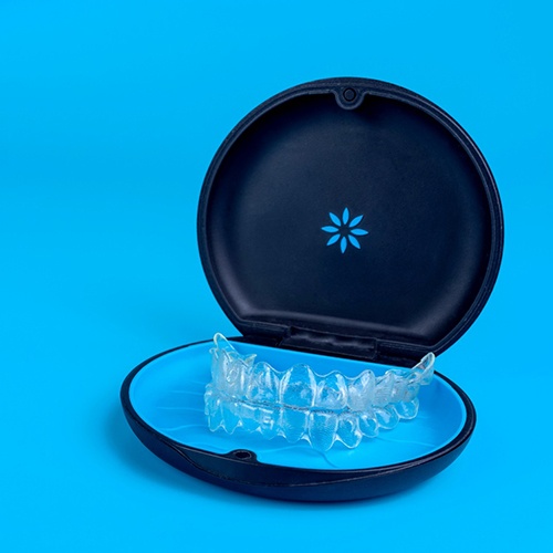 Invisalign in carrier case with blue background