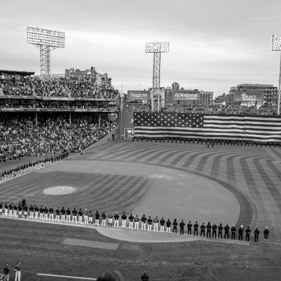 Baseball stadium saluting the American flag