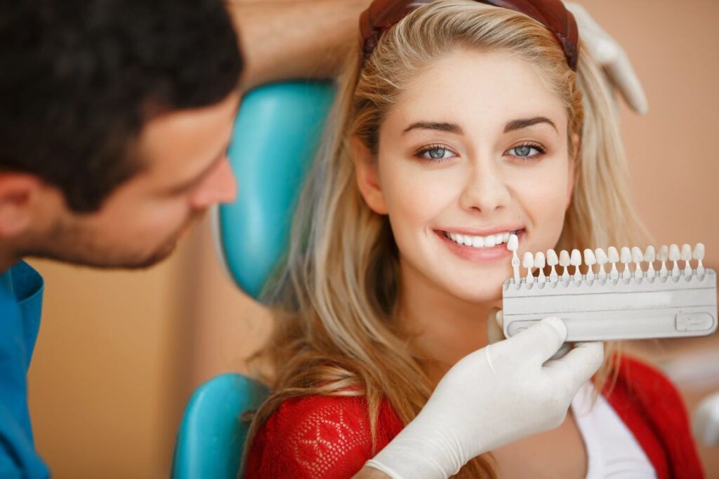 A woman getting professional whitening from her dentist