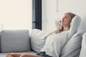 Woman relaxing on her sofa at home